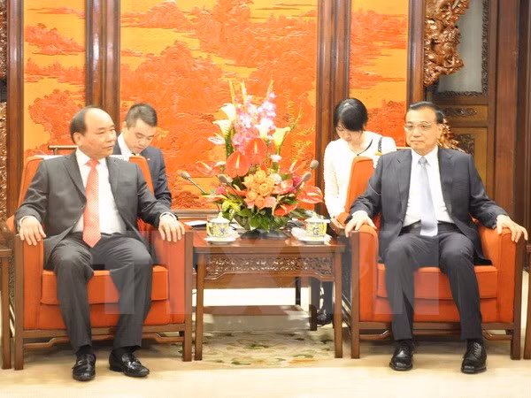 Le vice-PM Nguyen Xuan Phuc rencontre le PM chinois ảnh 1