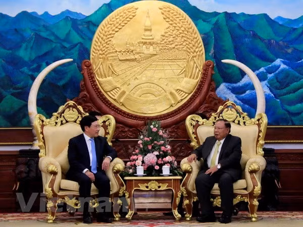 Le vice-PM Pham Binh Minh en visite officielle au Laos ảnh 1