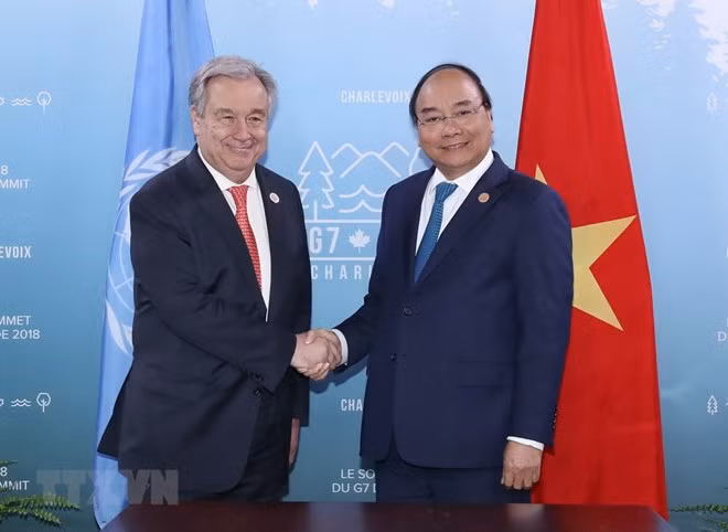 Sommet du G7 élargi: le PM vietnamien rencontre des dirigeants du monde ảnh 1