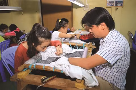 Le Vietnam œuvre pour les droits des handicapés ảnh 2