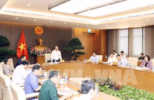 Le PM Nguyen Xuan Phuc préside une réunion sur la préparation du WEF-ASEAN ảnh 1