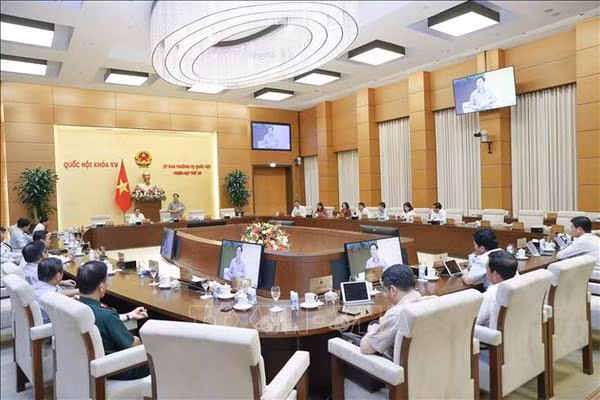 Clôture de la 26e session du Comité permanent de la 15e AN ảnh 1