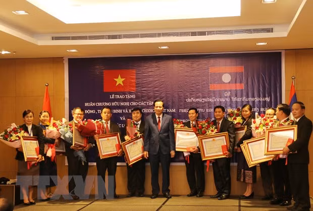Vietnam et Laos promeuvent la coopération dans le domaine du travail et du bien-être sociale ảnh 1