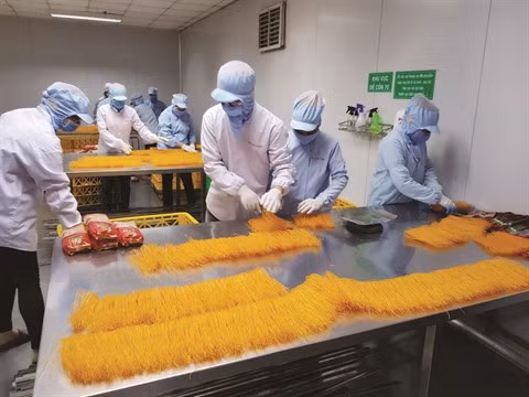 La galette de riz, un biais par lequel s’exprime le patriotisme ảnh 2