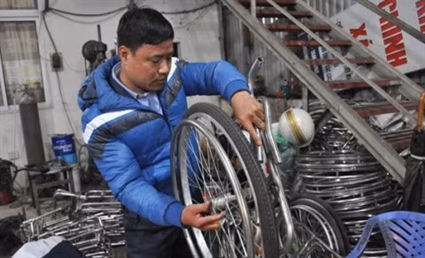 Pour une meilleure intégration des handicapés ảnh 1