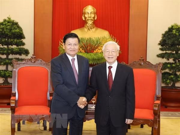 Le leader du PCV reçoit le Premier ministre laotien ảnh 1 Le leader du PCV reçoit le Premier ministre laotien ảnh 1