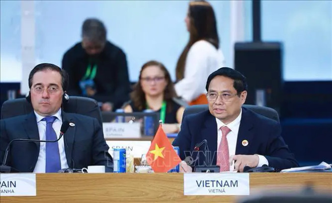 Le Premier ministre Pham Minh Chinh lors de la séance de discussion sur « le développement durable et la transition énergétique ». Photo : VNA 2.jpg