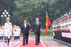 Le PM Pham Minh Chinh préside la cérémonie d'accueil de son homologue lao