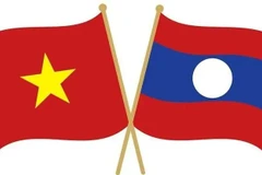 Drapeaux nationaux du Vietnam et du Laos. Photo : sggp.org.vn