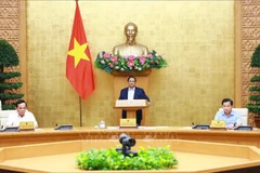 Le Premier ministre Pham Minh Chinh préside la réunion. Photo: VNA