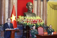 Le président Nguyen Xuan Phuc rencontre des vétérans de la Division 341