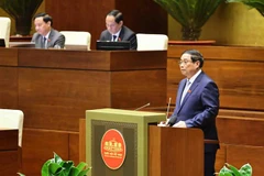 Le Premier ministre Pham Minh Chinh prononce un discours dans le cadre de la 8e session en cours de la 15e Assemblée nationale (AN), le 12 novembre. Photo: VNA