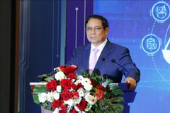Le Premier ministre Pham Minh Chinh s’exprimant lors de la conférence de présentation du modèle réussi de transformation numérique aux niveaux ministériel et sectoriel des juridictions populaires. Photo: VNA