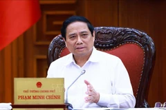 Le Premier ministre Pham Minh Chinh lors de la réunion, à Hanoi, le 17 mai. Photo: VNA