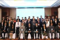Les délégués au 11e Forum international sur le socialisme, à Vientiane, le 8 novembre. Photo: VNA