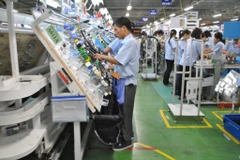 Usine de production de câbles électriques pour voitures et motos dans la compagnie Sumi Vietnam, à capital japonais, basée dans le parc industriel de Thanh Liêm, province de Hà Nam. Photo : CTV
