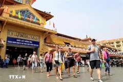 Touristes à Ho Chi Minh-Ville. Photo: VNA