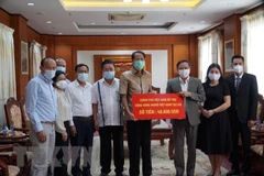 COVID-19 : Le gouvernement vietnamien continue d'assister les Viet kieu au Laos