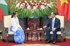Le président Tran Dai Quang reçoit la conseillère d'Etat du Myanmar