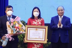 Le président remet l’Ordre du travail au district de Cu Chi à Ho Chi Minh-Ville