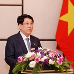 Le président Luong Cuong s'exprime lors de la rencontre avec des Vietnamiens vivant au Laos. Photo: VNA