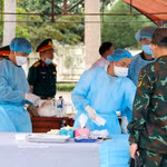 Prélèvement d’échantillons de restes de martyrs au cimetière des martyrs de la commune de Duc Linh. Photo: VNA