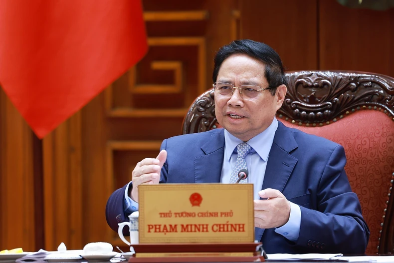 Le Premier ministre Pham Minh Chinh s'exprime lors de la réunion. Photo: VNA