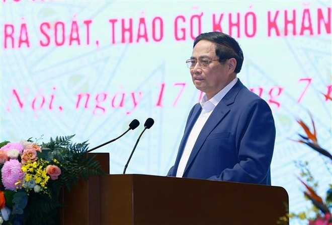 Le Premier ministre Pham Minh Chinh lors de l'événement. Photo: VNA vna-potal-thu-tuong-chu-tri-hoi-nghi-toan-quoc-danh-gia-ket-qua-thao-go-kho-khan-cho-cac-du-an-8154385.jpg