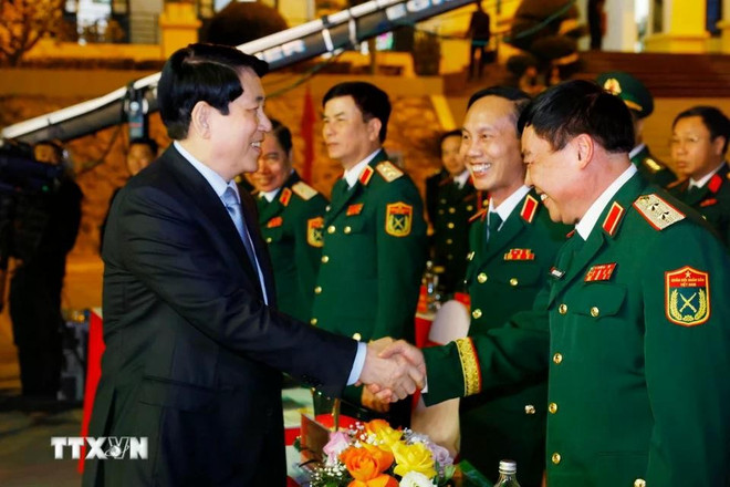 Le président Luong Cuong et des délégués au programme. Photo: VNA luong-cuong-xuan-bien-gioi-1.jpg