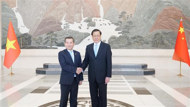 Le Minh Tri, président de la Cour populaire suprême du Vietnam, et Ying Yong, procureur général du Parquet populaire suprême de Chine. Photo: VNA vna-potal-chanh-an-toa-an-nhan-dan-toi-cao-tham-lam-viec-tai-trung-quoc-8078711.jpg