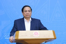 Le Premier ministre Pham Minh Chinh s'exprime lors de la conférence. Photo: VNA