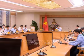 Réunion concernant le déploiement des 11 secteurs technologiques stratégiques. Photo: VNA