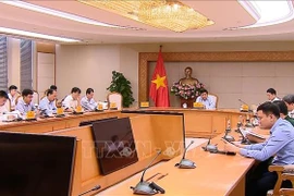 Réunion concernant le déploiement des 11 secteurs technologiques stratégiques. Photo: VNA