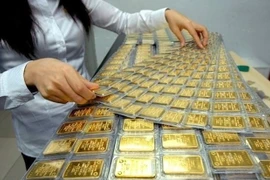 La Banque d’État du Vietnam coopérera avec le ministère de la Sécurité publique pour la gestion du marché de l’or. Photo: VietnamPlus