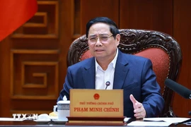 Le Premier ministre Pham Minh Chinh s'exprime lors de la réunion. Photo: VNA