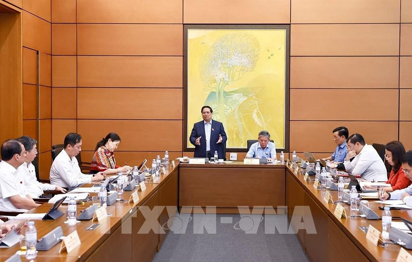 Le Premier ministre Pham Minh Chinh lors des discussions en groupes dans le cadre de la 9e session de l’Assemblée nationale, le 23 mai. Photo: VNA