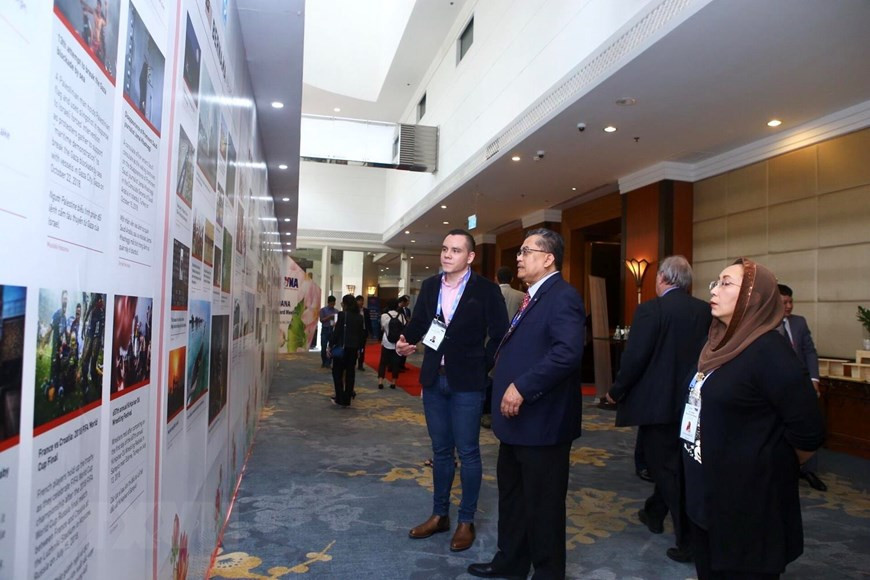 Les délégués internationaux participent à cet événement. Photo: VNA 