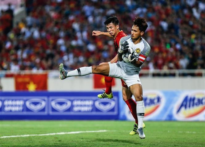 Le défenseur Bui Tiên Dung (maillot rouge). Photo: VNA