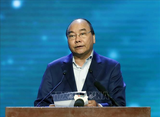 Le Premier ministre Nguyên Xuân Phuc s'exprime lors du programme. Photo: VNA