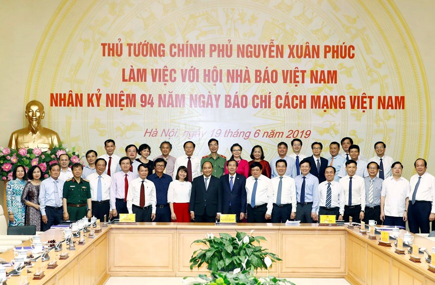 Les délégués prennent la photo.