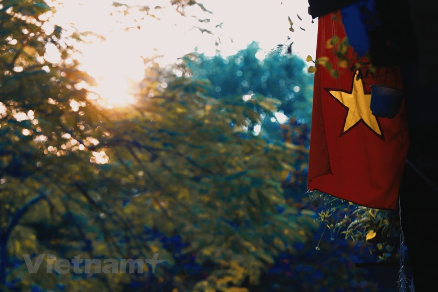 Les vieux coins de rue pleins de nostalgie sont légions. Peu importe à quel point les rues sont animées et animées, les gens s'y sentent toujours étrangement paisibles. Photo: VietnamPlus