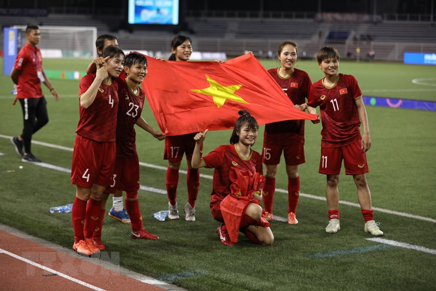 Les Vietnamiennes expriment leur joie après le match. Photo: VNA