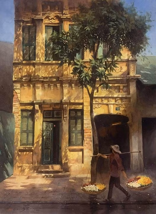 La couleur jaune des anciennes maisons de Hanoï et les couleurs colorées des vendeurs ambulants de fleurs constituent l'une des combinaisons préférées du peintre Phong Hoang.