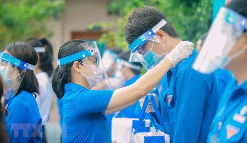 Des jeunes volontaires à la campagne de vaccination contre le coronavirus à Ho Chi Minh-Ville. Photo: VNA