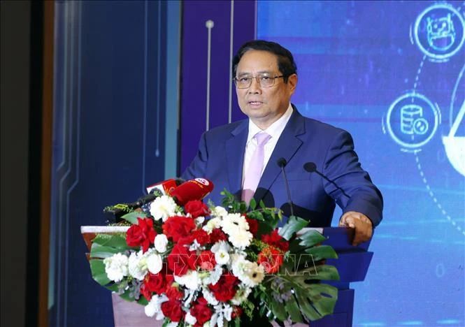 Le Premier ministre Pham Minh Chinh s’exprimant lors de la conférence de présentation du modèle réussi de transformation numérique aux niveaux ministériel et sectoriel des juridictions populaires. Photo: VNA