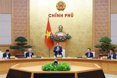Le Premier ministre Pham Minh Chinh préside le 6 décembre la réunion gouvernementale périodique du mois de novembre 2025. Photo: VNA