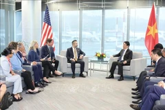 Panorama de la rencontre entre le président de la République, Luong Cuong, et la délégation de parlementaires de l’État de l’Oregon. Photo: VNA