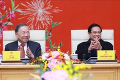 Le secrétaire général To Lam et le Premier ministre Pham Minh Chinh lors de la rencontre. Photo : VNA