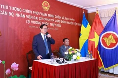 Le Premier ministre Pham Minh Chinh prend la parole lors de la rencontre. Photo: VNA