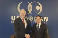 Le ministre l’Agriculture et de l'Environnement, Do Duc Duy, et Ted Osius, président et directeur général de l’USABC. Photo: VNA